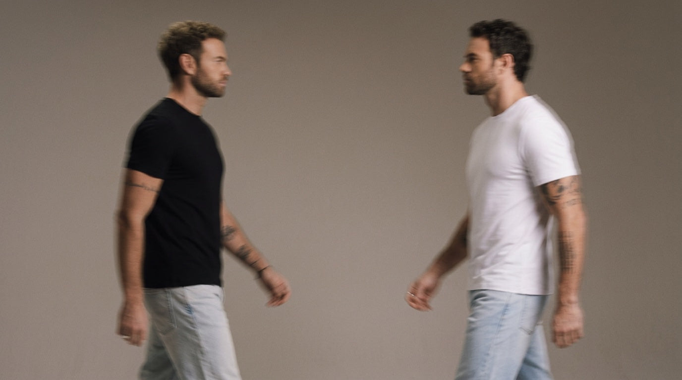 Two men wearing The Tech Shirt, one in black and one in white